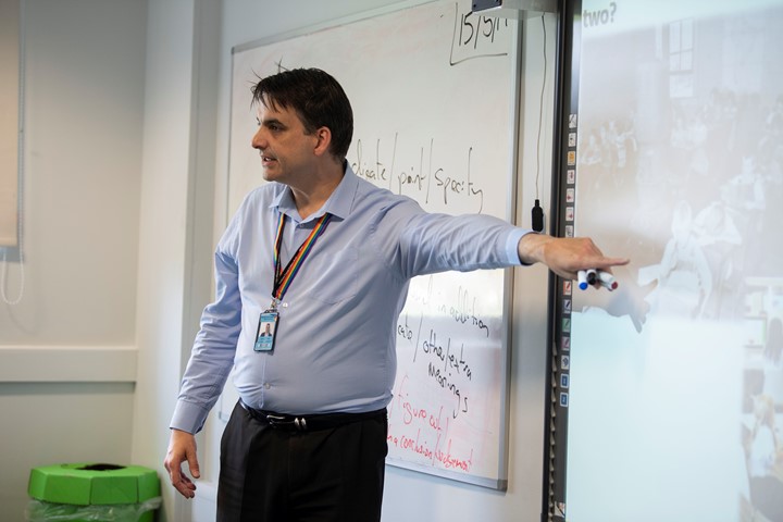 Teacher pointing at whiteboard